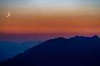 Crescent moon sets over the Whitefish Range in the Stillwater State Forest, Montana, USA Art Print